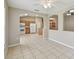 Open dining area with tile floors, neutral paint and flow into the kitchen and entry to another room at 2609 Rosehaven Dr, Wesley Chapel, FL 33544