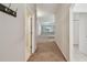 Inviting hallway leads into an open floorplan with access to multiple rooms at 2609 Rosehaven Dr, Wesley Chapel, FL 33544