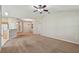 Large living room with carpet flooring and open floor plan at 2609 Rosehaven Dr, Wesley Chapel, FL 33544