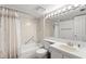 Clean bathroom with a shower-tub, and a white sink with a white vanity at 2699 Pine Ridge E Way # H2, Palm Harbor, FL 34684