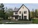 Elegant two-story home with manicured greenery and a welcoming covered entryway, framed by large windows at 2719 13Th N St, St Petersburg, FL 33704