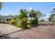 Charming street view of a home with a well-manicured lawn and brick-paved street, exuding curb appeal at 3108 56Th S St, Gulfport, FL 33707