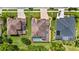 Aerial view of properties showcasing well-maintained lawns, pools, and screened-in lanai areas at 3148 Watermark Dr, Wesley Chapel, FL 33544