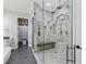 Bathroom featuring a spacious glass shower with double shower heads and built-in bench seating at 3148 Watermark Dr, Wesley Chapel, FL 33544