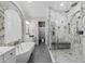 The bathroom boasts a luxurious soaking tub, a spacious glass shower, and marble accents at 3148 Watermark Dr, Wesley Chapel, FL 33544