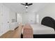 Beautiful bedroom features light walls, wood floor, and a ceiling fan at 3148 Watermark Dr, Wesley Chapel, FL 33544