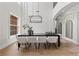 Bright dining room featuring modern decor, contemporary lighting, and a spacious layout for gatherings at 3148 Watermark Dr, Wesley Chapel, FL 33544