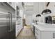 Spacious kitchen with stainless steel appliances, long island, and modern pendant lighting at 3148 Watermark Dr, Wesley Chapel, FL 33544