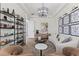 Cozy living room featuring stylish decor, modern lighting, comfortable seating, and ample natural light at 3148 Watermark Dr, Wesley Chapel, FL 33544