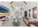Open concept living room with a fireplace, access to kitchen, and comfortable seating arrangements at 3148 Watermark Dr, Wesley Chapel, FL 33544