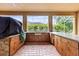 Spacious outdoor kitchen with stainless steel grill and bar for entertaining with custom cabinets at 3148 Watermark Dr, Wesley Chapel, FL 33544