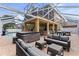 Enclosed patio features outdoor seating, hot tub, and outdoor bar at 3148 Watermark Dr, Wesley Chapel, FL 33544