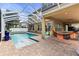 Enclosed patio features pool and outdoor seating, plus an outdoor bar at 3148 Watermark Dr, Wesley Chapel, FL 33544