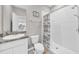 Bathroom featuring a shower and a sink with granite countertop at 32136 Conchshell Sail St, Wesley Chapel, FL 33545