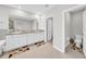 This bathroom offers a dual vanity, storage, granite counters, and tile floors at 32136 Conchshell Sail St, Wesley Chapel, FL 33545