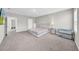 This bedroom offers carpeted floors, neutral walls, a queen bed, and lots of natural light at 32136 Conchshell Sail St, Wesley Chapel, FL 33545