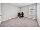 Bedroom with carpet, a desk, chair, and a window for natural light at 32136 Conchshell Sail St, Wesley Chapel, FL 33545