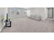Carpeted bonus room with sofa, large windows, and recessed lighting at 32136 Conchshell Sail St, Wesley Chapel, FL 33545