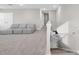 Spacious carpeted bonus room with a sofa, staircase, and natural light at 32136 Conchshell Sail St, Wesley Chapel, FL 33545