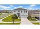 Charming two-story home with well-manicured lawn and landscaping in a Gathering-friendly neighborhood at 32136 Conchshell Sail St, Wesley Chapel, FL 33545