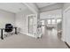 Bright foyer featuring a home office, stylish decor, and an inviting entryway to the main living area at 32136 Conchshell Sail St, Wesley Chapel, FL 33545