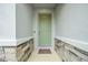 Inviting front entrance with a light green door and stone accents at 32136 Conchshell Sail St, Wesley Chapel, FL 33545
