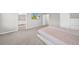 The carpeted main bedroom boasts an ensuite bathroom and wall-mounted television at 32136 Conchshell Sail St, Wesley Chapel, FL 33545