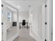 Home office with French doors, natural light and modern desk at 32136 Conchshell Sail St, Wesley Chapel, FL 33545