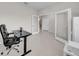 Bright and airy office with glass paneled doors and neutral tile flooring at 32136 Conchshell Sail St, Wesley Chapel, FL 33545