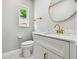 Bathroom featuring a white vanity with gold fixtures at 325 Gladstone Blvd, Englewood, FL 34223