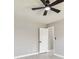 A gray bedroom showcasing a fan and closet at 325 Gladstone Blvd, Englewood, FL 34223