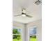 Bedroom with a modern ceiling fan and views of the yard at 325 Gladstone Blvd, Englewood, FL 34223