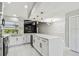 Spacious updated kitchen with white cabinets, quartz countertops, decorative backsplash, and stainless steel appliances at 325 Gladstone Blvd, Englewood, FL 34223