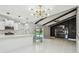 Open-concept living room with updated kitchen, vaulted ceiling, and sliding glass doors to the backyard pool at 325 Gladstone Blvd, Englewood, FL 34223