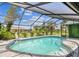 Inviting pool area under a screened enclosure with a beautiful garden area surrounding it at 325 Gladstone Blvd, Englewood, FL 34223