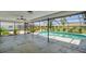 Screened patio showcasing a beautiful pool and lush landscaping for outdoor enjoyment at 325 Gladstone Blvd, Englewood, FL 34223