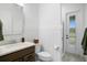 Bright bathroom featuring a stylish vanity with a stone countertop, complemented by modern fixtures and clean, white accents at 3559 Maple Bay Ln, Land O Lakes, FL 34638