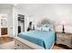 Comfortable bedroom with a luxurious bed, stylish decor, and a walk-in closet for ample storage at 3559 Maple Bay Ln, Land O Lakes, FL 34638