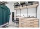 Well-organized closet with clothing, drawers, and shelves, including a safe for valuables at 3559 Maple Bay Ln, Land O Lakes, FL 34638