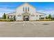 Charming community center with dedicated parking spots and stylish white architecture at 3559 Maple Bay Ln, Land O Lakes, FL 34638
