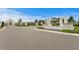 Welcoming entrance to Whispering Pines, featuring stone accents, lush greenery, and a modern community sign at 3559 Maple Bay Ln, Land O Lakes, FL 34638