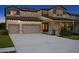 Charming two-story home with inviting front porch, well-manicured landscaping, and a spacious driveway at 3559 Maple Bay Ln, Land O Lakes, FL 34638