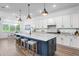 Spacious kitchen boasts stainless steel appliances, a large island, and eat-in dining area, perfect for entertaining at 3559 Maple Bay Ln, Land O Lakes, FL 34638