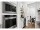 Modern kitchen showcasing stainless steel appliances, built-in microwave, and convenient access to dining area at 3559 Maple Bay Ln, Land O Lakes, FL 34638