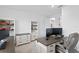 Well-lit home office featuring a desk, cabinets, shelving, and comfortable chair at 3559 Maple Bay Ln, Land O Lakes, FL 34638