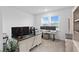 Spacious office with natural light, three computer monitors, and neutral paint color on the wall at 3559 Maple Bay Ln, Land O Lakes, FL 34638