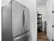 Pantry with shelving and a stainless steel refrigerator at 3559 Maple Bay Ln, Land O Lakes, FL 34638
