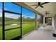 Relaxing screened patio with lake view, ideal for enjoying the outdoors in comfort and style at 3559 Maple Bay Ln, Land O Lakes, FL 34638