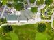 Birds-eye view of clubhouse with a patio, a parking lot, a garden, and putting green at 3633 Morgans Bluff Ct, Land O Lakes, FL 34639