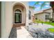 Elegant front entrance featuring meticulously maintained landscaping and a welcoming walkway at 3633 Morgans Bluff Ct, Land O Lakes, FL 34639